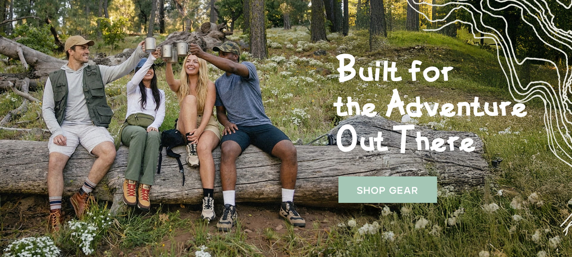 people sitting on a large log in a forest clearing, raising mugs in a toast. WILLIT clothing built for outdoor adventures.