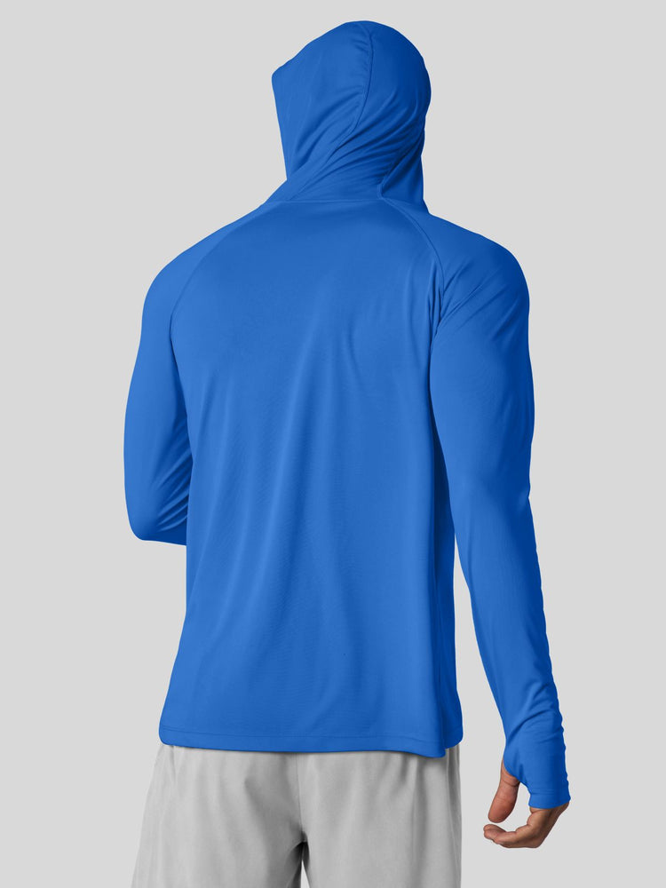 A man wearing a bright blue long-sleeve athletic hoodie 