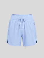 Women's light blue athletic shorts with a drawstring waistband, side pockets, and side gussets 