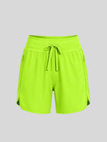 WILLIT Women's right neon yellow-green athletic shorts with a matching drawstring waistband  