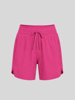 Women's bright pink athletic shorts with a drawstring waistband  