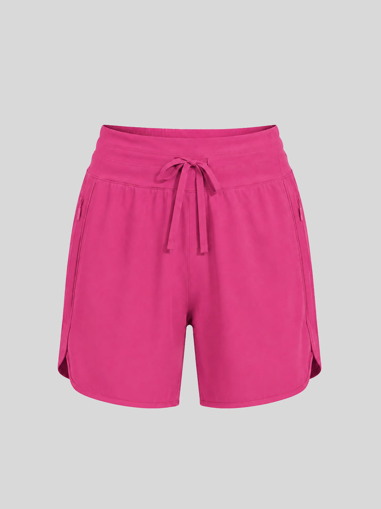 Women's bright pink athletic shorts with a drawstring waistband  