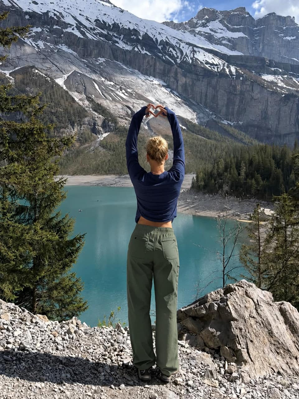 UGC content-women stands on a rocky mountainside with her back to the camera, willit women's sun shirts and willit women's hiking pants