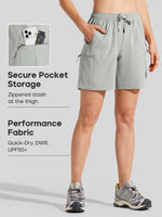 women's athletic shorts with side pockets and a drawstring waist, featuring callouts for secure pocket storage and performance fabric. 