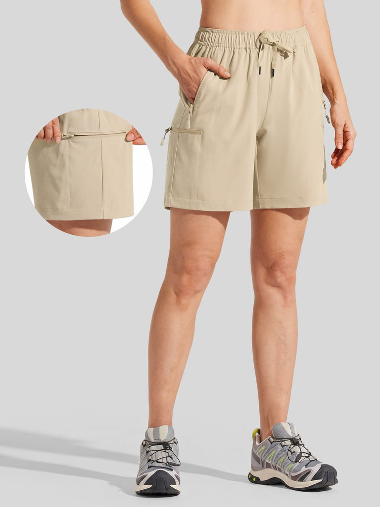 women's beige drawstring shorts with side cargo pockets with highlights the side zip pocket detail 