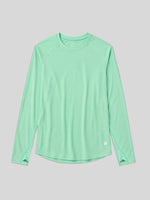 A mint green long-sleeve athletic top with raglan sleeves and a curved hem, displayed flat 