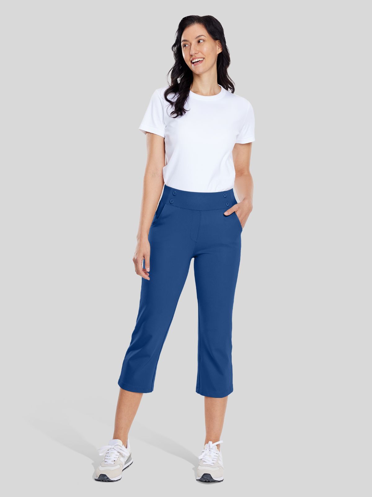 A woman modeling blue cropped capri pants 