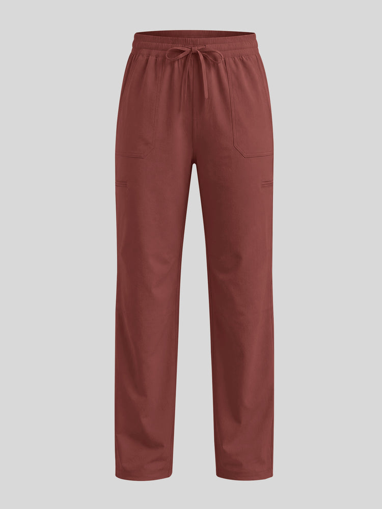 A pair of brick red pants with an elastic drawstring waist and side pockets 
