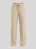 Beige scrub pants with an elastic drawstring waist and side pockets 