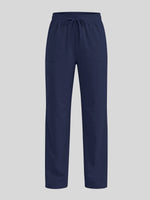 A pair of navy blue scrub pants with an elastic waistband and drawstring 