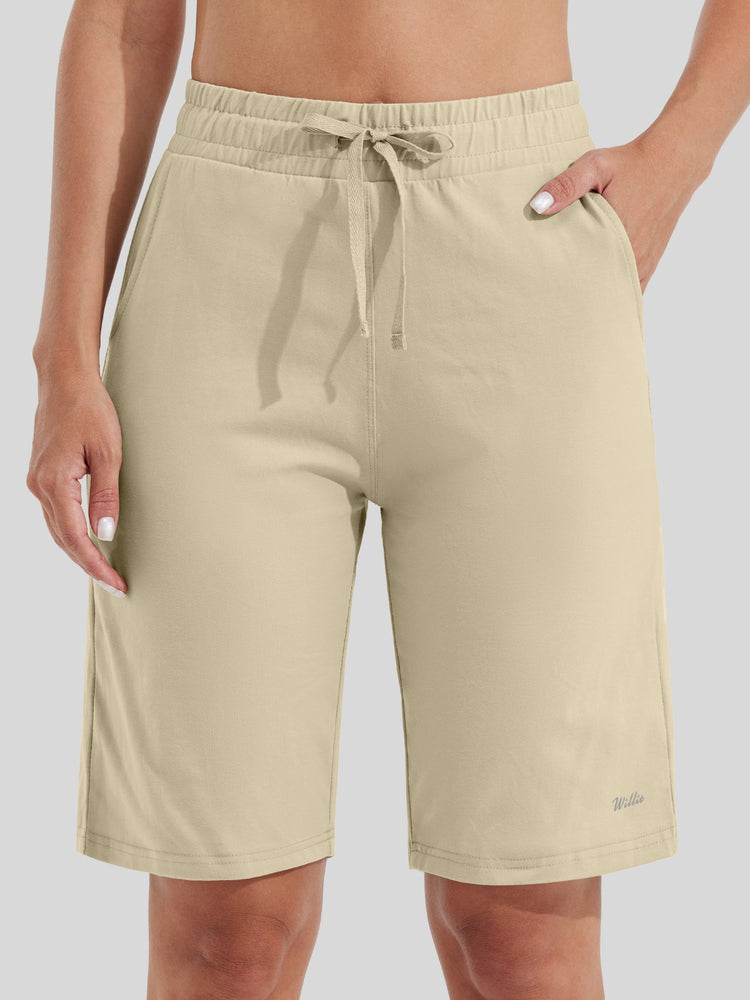 women wearing light beige drawstring cotton bermuda shorts with side pockets 