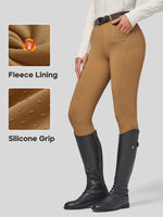 Women's riding breeches show on a model from the waist down, paired with black riding boots - Fabric features fleece lining and silicone grip texture 
