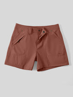 A pair of women's outdoor shorts with a button closure and zippered side pockets display flat 