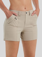 Beige women's outdoor shorts with side pockets, shown on a model from the waist to mid-thigh 
