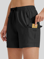 Black athletic shorts with an elastic drawstring waist and a large front utility pocket 