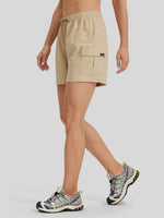 A model wearing beige cargo shorts with a drawstring waist and a side utility pocket 