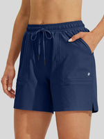 A close-up of a women wearing navy blue drawstring shorts lightweight for hiking 