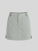 A light gray utility mini skirt with a button closure, belt loops, and front pockets 