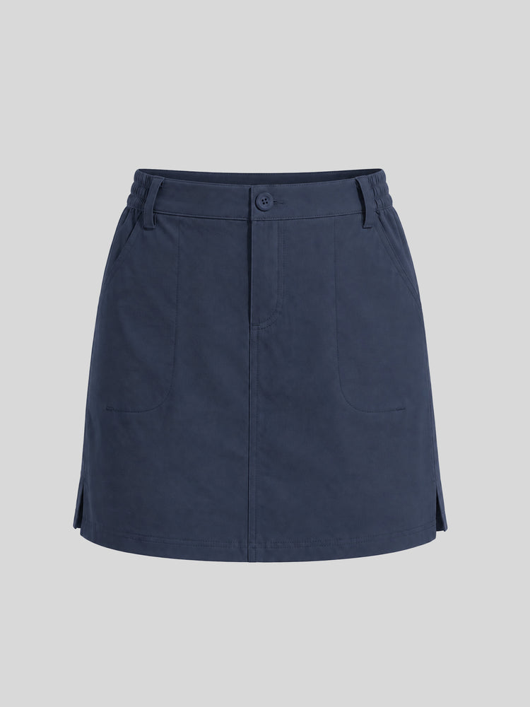 A navy blue utility-style mini skirt with a button closure at the waist, belt loops, side pockets, and a flared silhouette, 