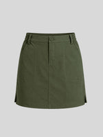 An olive green utility mini skirt with a button closure, belt loops, and side pockets 