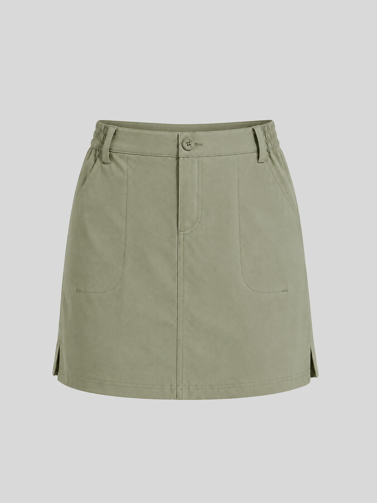 A sage green utility-style mini skirt with a button closure, belt loops, and front patch pockets 