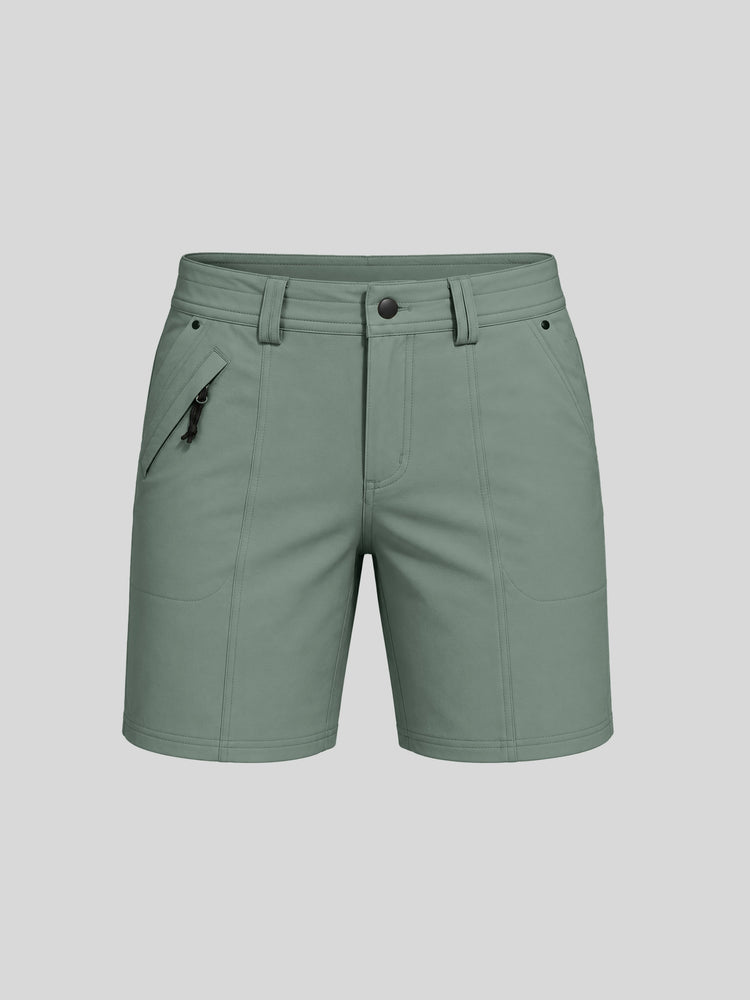 Women's sage-greeen outdoor golf shorts featuring a front zipper pocket and 7-inch inseam 