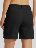 Rear view of a woman wearing black cargo shorts with a belt loop and side cargo pocket, 