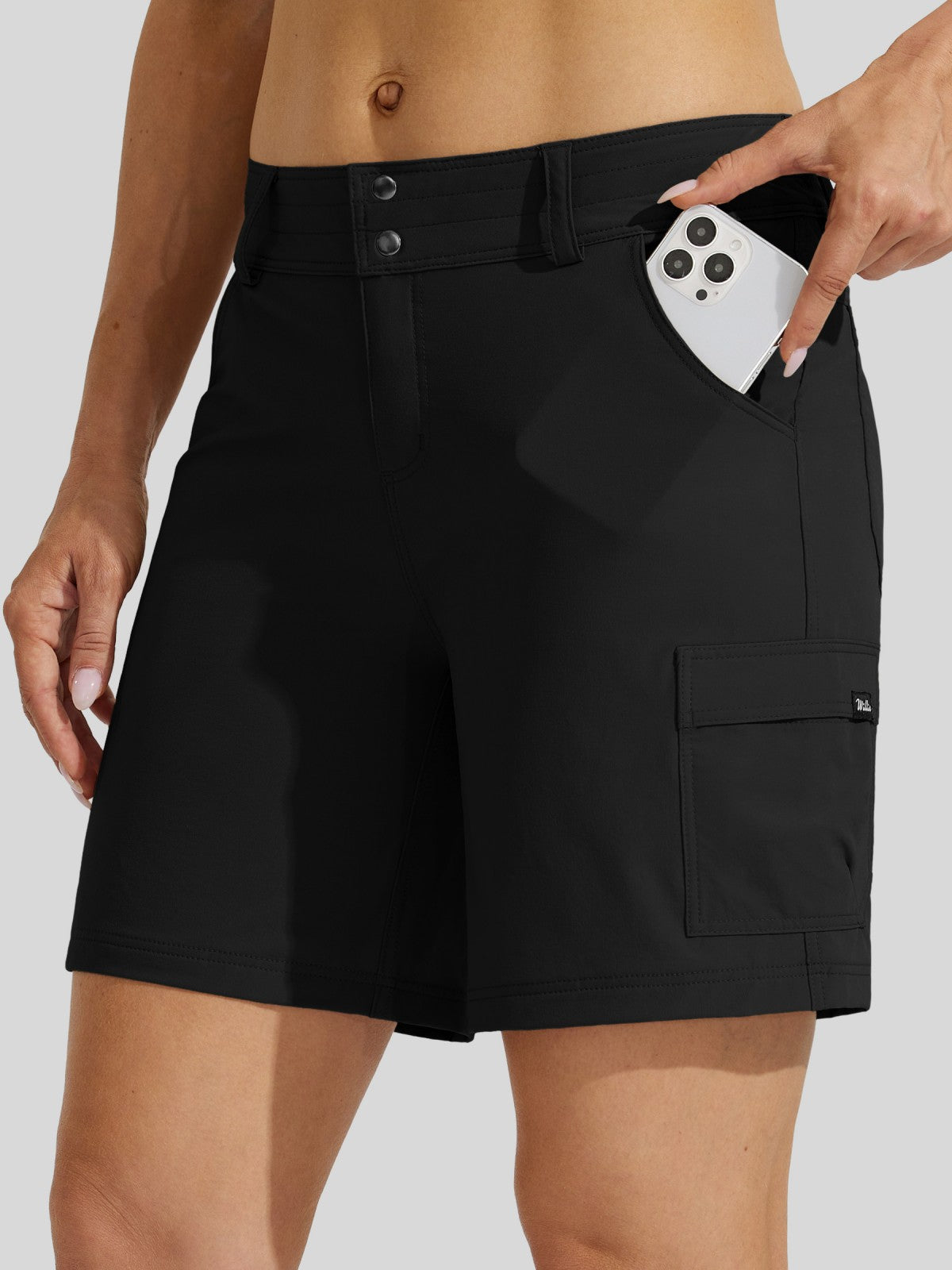Black cargo shorts with a buttoned waistband and side cargo pocket 