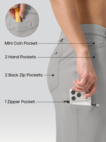 Light gray women's cargo pants shown on a model from the back, with overlaid callouts pointing to features: a mini coin pocket, 2 hand pockets, 2 back zip pockets, and 1 zipper pocket. A hand is shown placing a phone in one of the pockets, and a circular inset shows a yellow item in the mini coin pocket. 