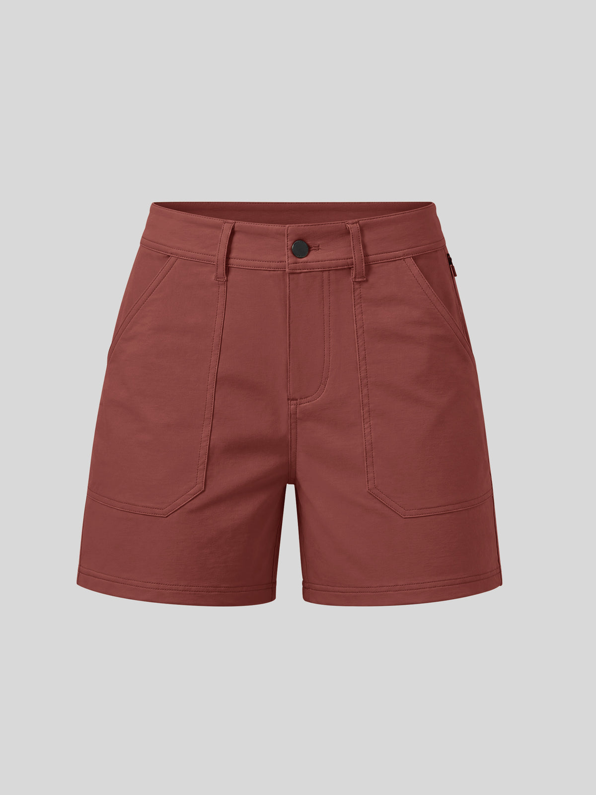 A pair of dusty rose utility shorts with a button closure, belt loops, and large front patch pockets 