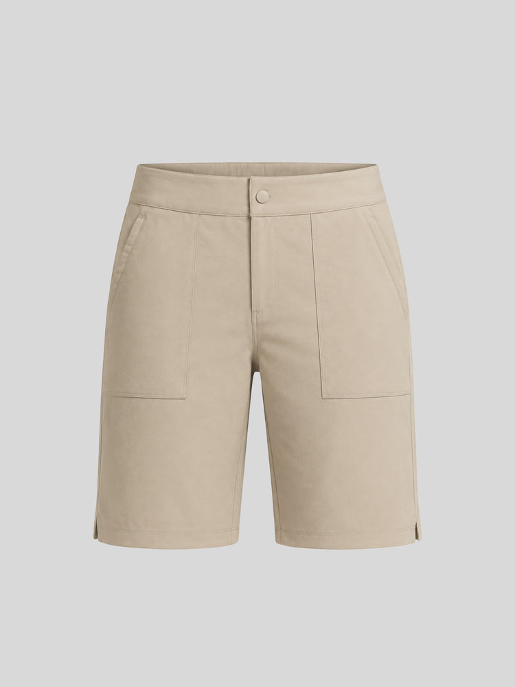 A pair of women's beige utility shorts with a button closure, front pockets, and side slits 